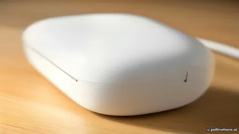White AirPods charging case on a desk