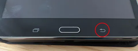 A modern Samsung Galaxy tablet with a stylus on a clean desk.