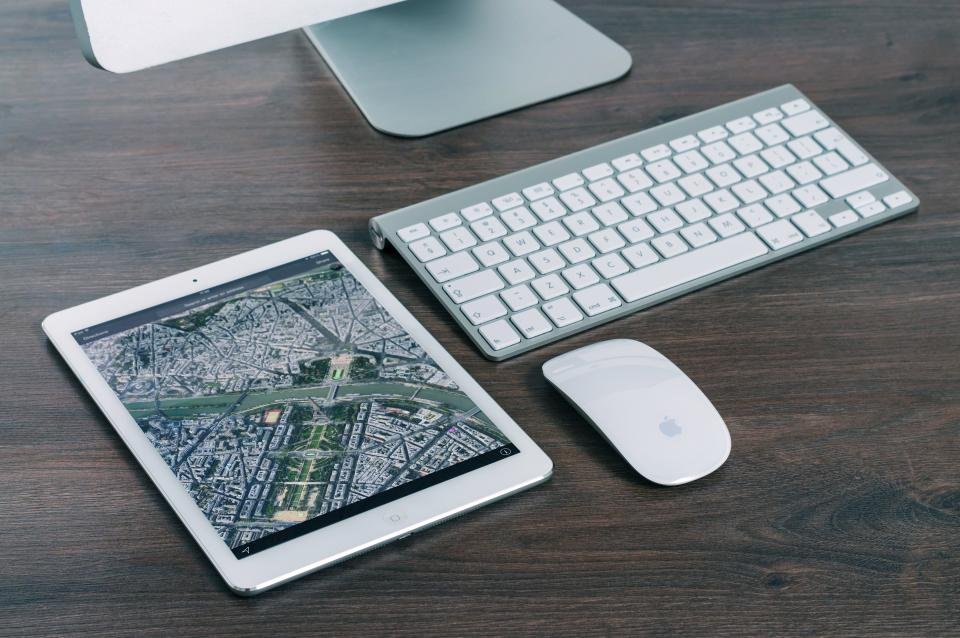 A modern computer desktop setup displaying system optimization software.