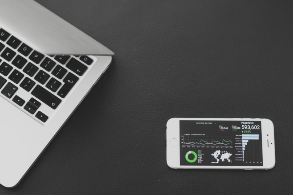Laptop displaying AI assistant comparison on a clean desk.