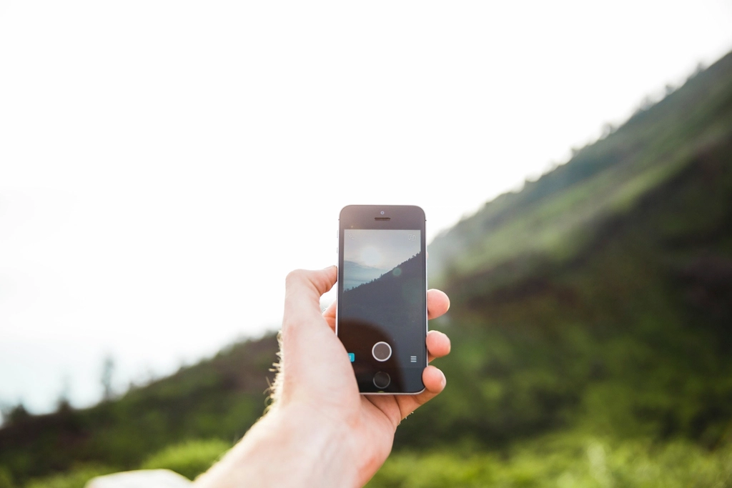 An iPhone screen showing settings menus and account options.