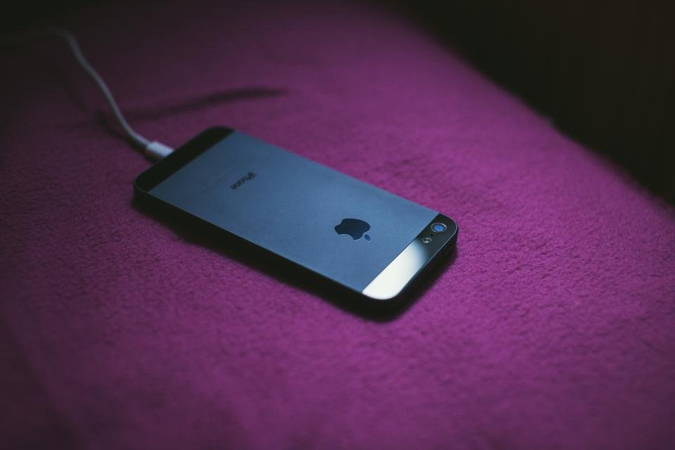 Close-up of cleaning an iPhone charging port