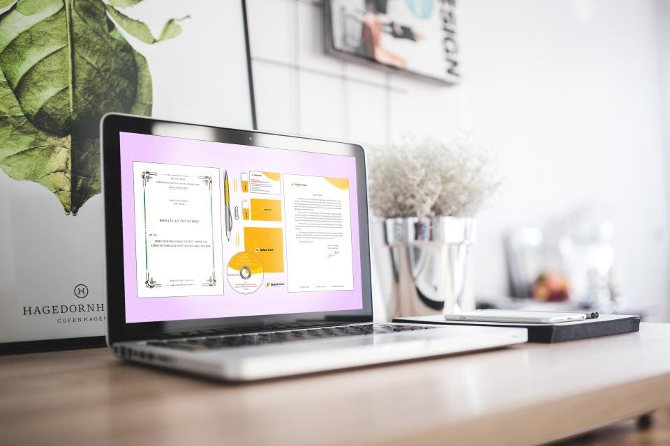A MacBook Pro displaying a productivity workspace on a modern office desk.