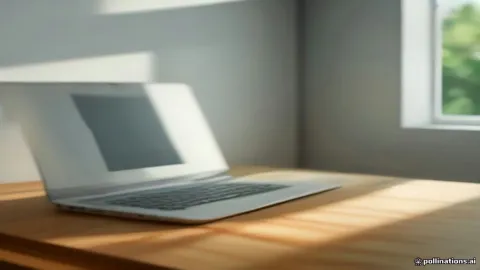 A modern workspace desk with a laptop displaying coding and text editing software.