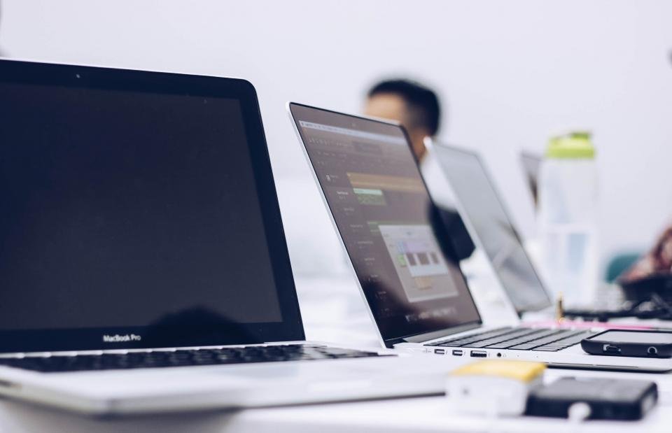 Comparison of two modern web browsers side-by-side on a laptop screen.