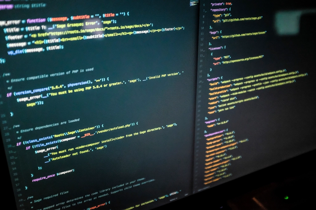 A clean desk setup showing Python code on a computer screen.