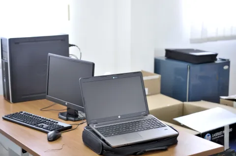 Person updating account security settings on a laptop