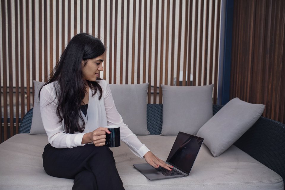 A laptop open on a modern desk displaying an AI productivity application interface.