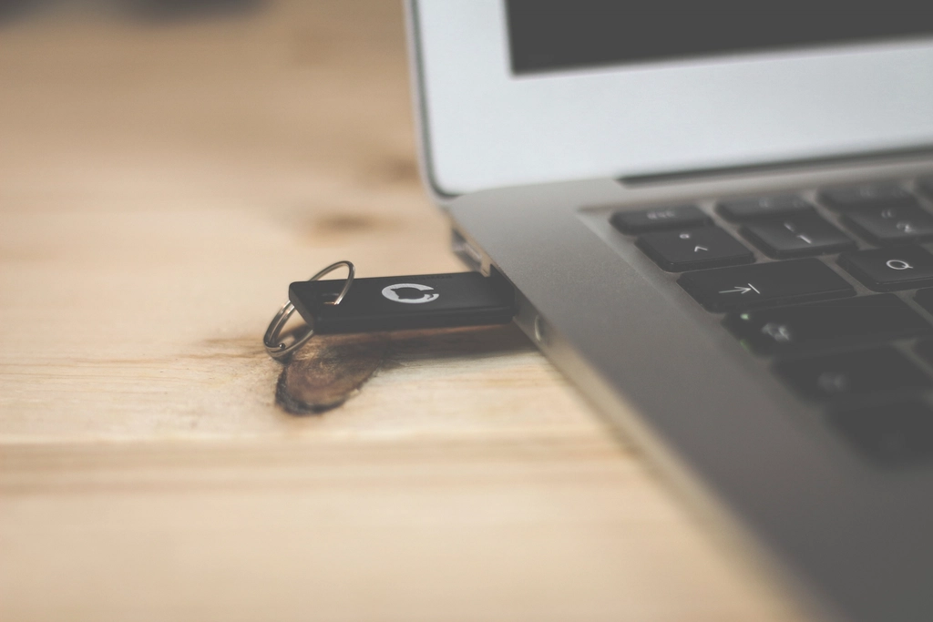 Wireless router and laptop on a wooden desk