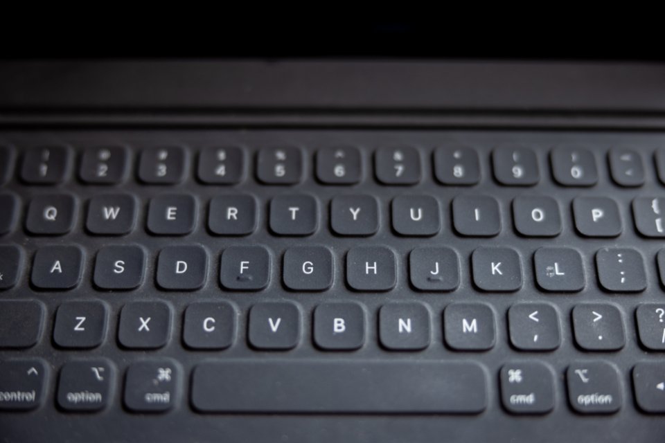 Laptop displaying Outlook email signature settings on screen