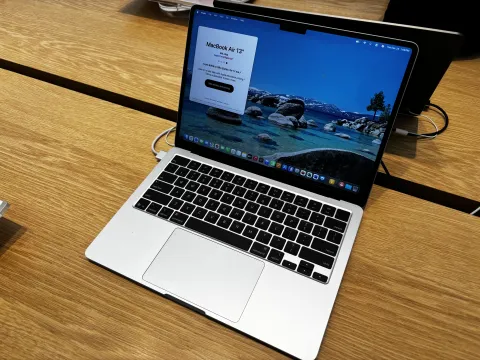 MacBook displaying Microsoft Excel on a desk