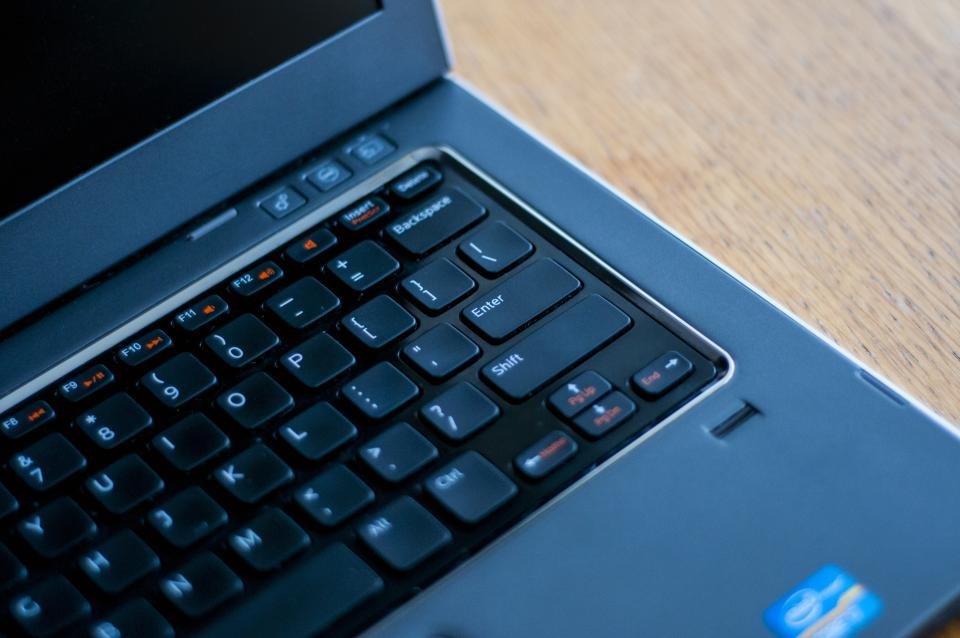 Laptop keyboard on a desk representing digital security and password management