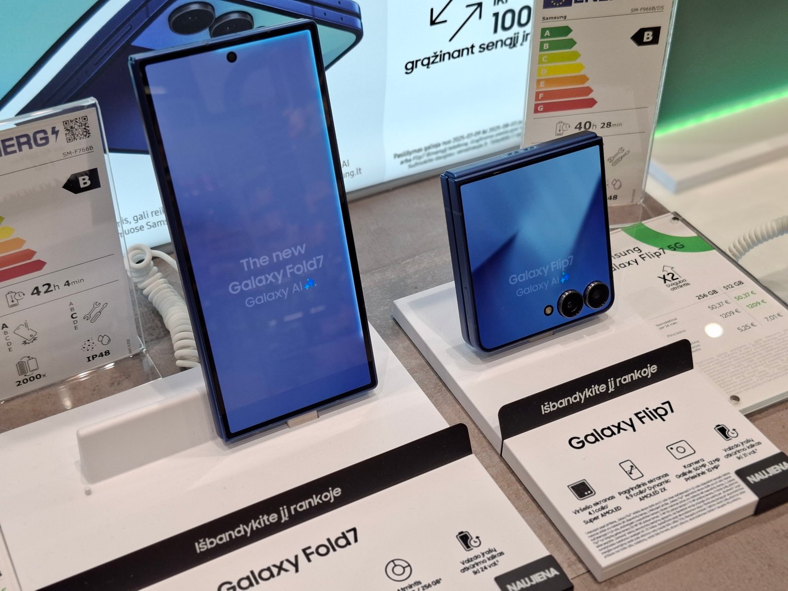 A Samsung smartphone undergoing troubleshooting on a clean workbench.