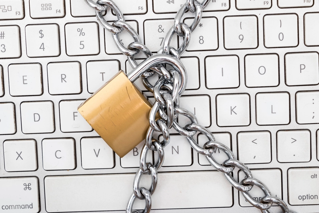 A secure password manager application interface displayed on a laptop screen.