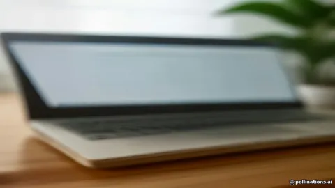 Laptop on a wooden office desk displaying an open text document